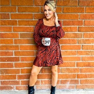 Rust zebra long sleeve dress